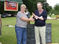 Patsy presenting James with his prize