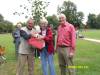 Ed presenting a plum tree to Pat and Alan Kahl